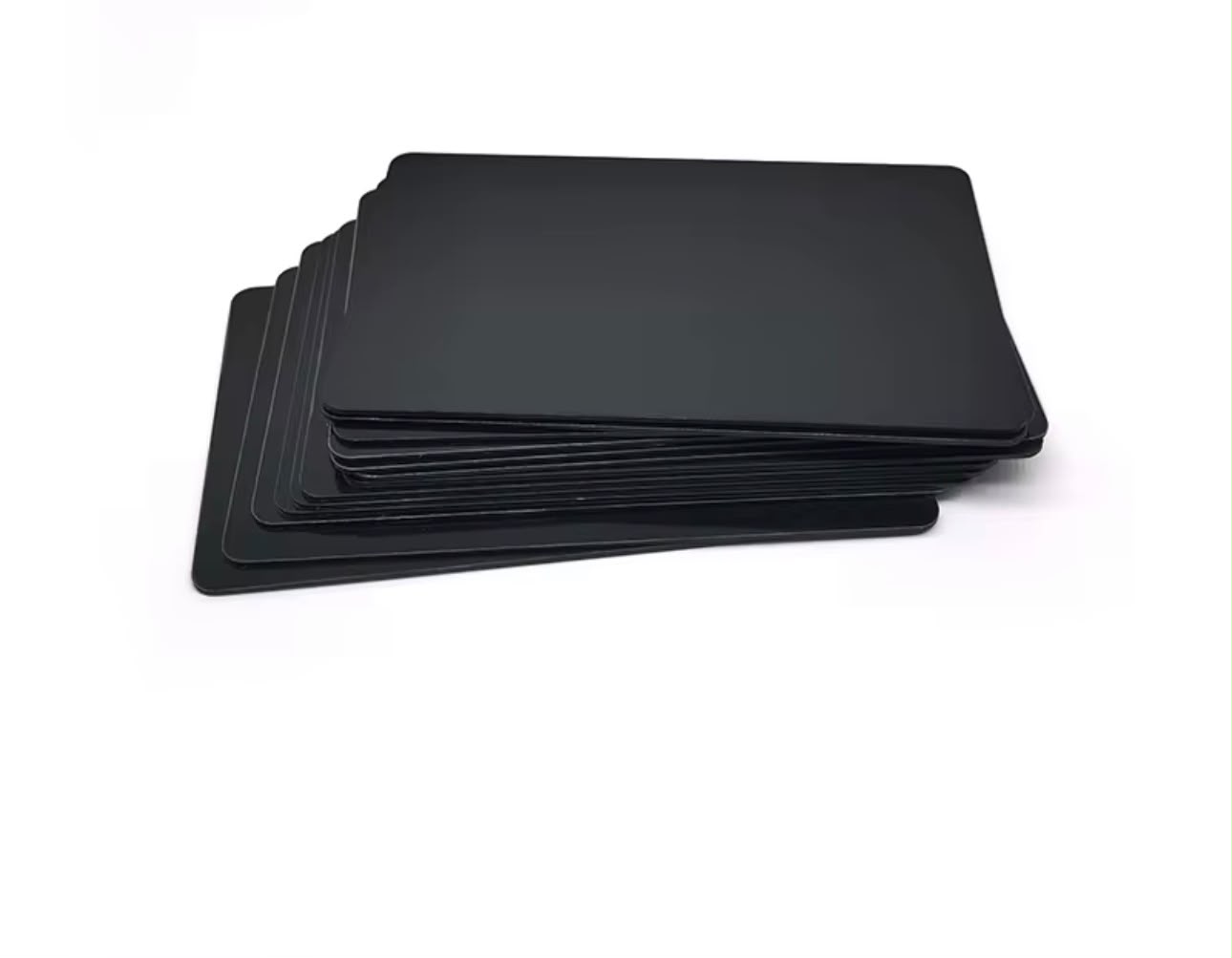 Stack of matte black Cardless NFC cards